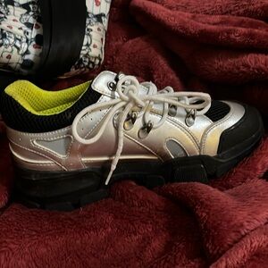 Gucci Women’s shoe Size 8 .. silver and Black. Great for up or down wear.